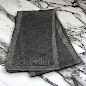 CALVIN KLEIN~CHARCOAL GRAY WITH DARK GRAY BORDER & LOGO AT BOTTOM OF SCARF~UEC